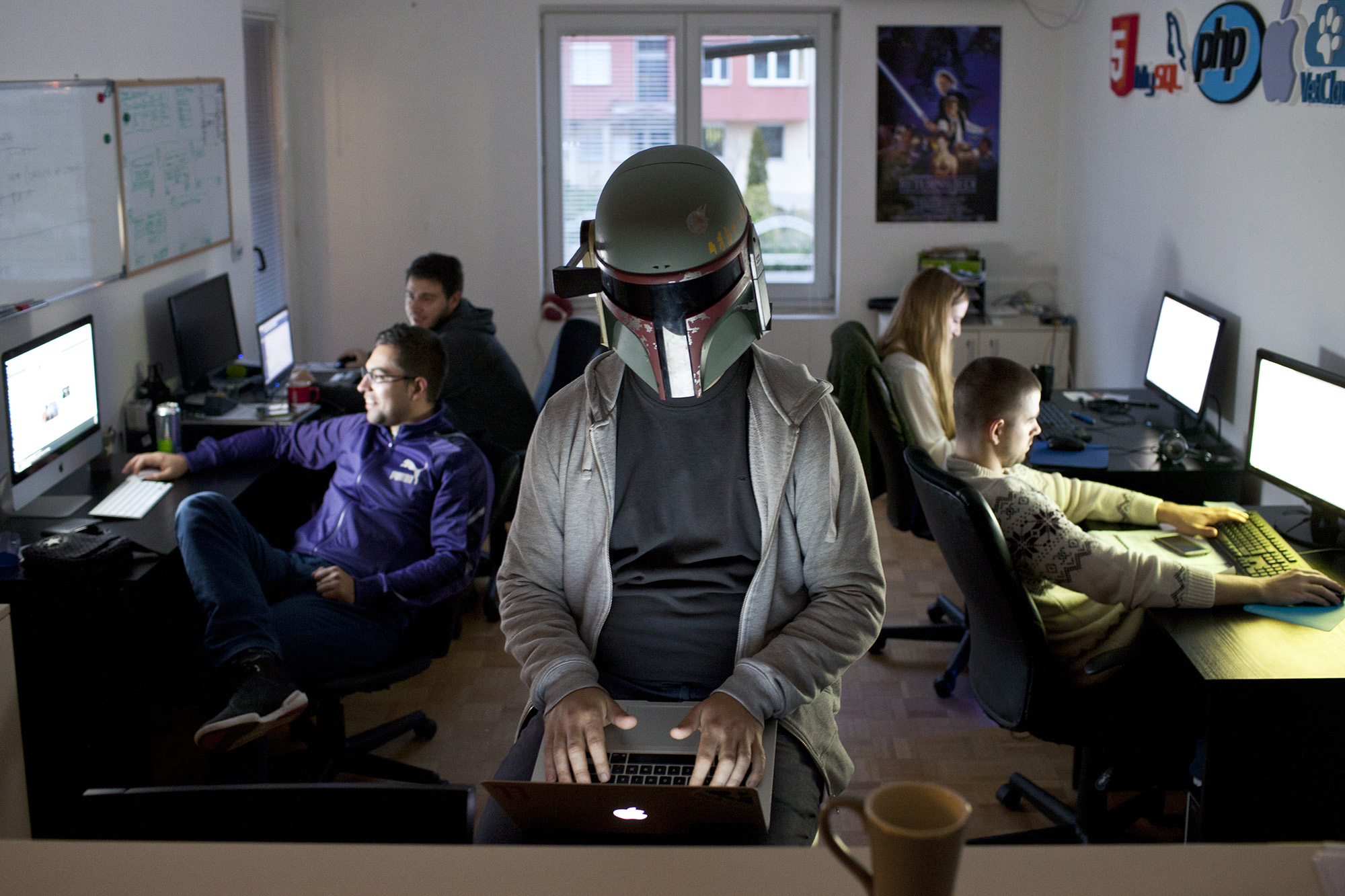 City of Nis, Serbia, 12/04/2014 Ivan Vesic, the co-founder of VetCloud, with the mask of Darth Vader, seen in the office of VetCloud, working together with his team (Stefan Milovanovic, Mirza Sejdinovic, Mia Petkovic, Nikola Zivkovic). VetCloud is a small Startup company established by Ivan Vesic and Mirza Sejdinovic in the city of Nish in southern Serbia. The startup is oriented towards making an online cloud  platform that provides services for veterinarians. Photo by MARKO RISOVIC for The International New York Times