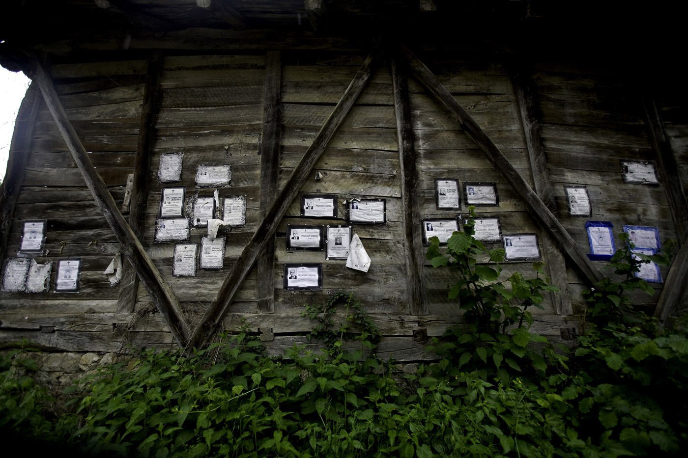 Obituaries on the barn in one of the villages in east serbia on the mountain of Stara planina. Almast all of them date couple of years ago, because village is unpopulated now. Only some road workers and travelers pass through it.