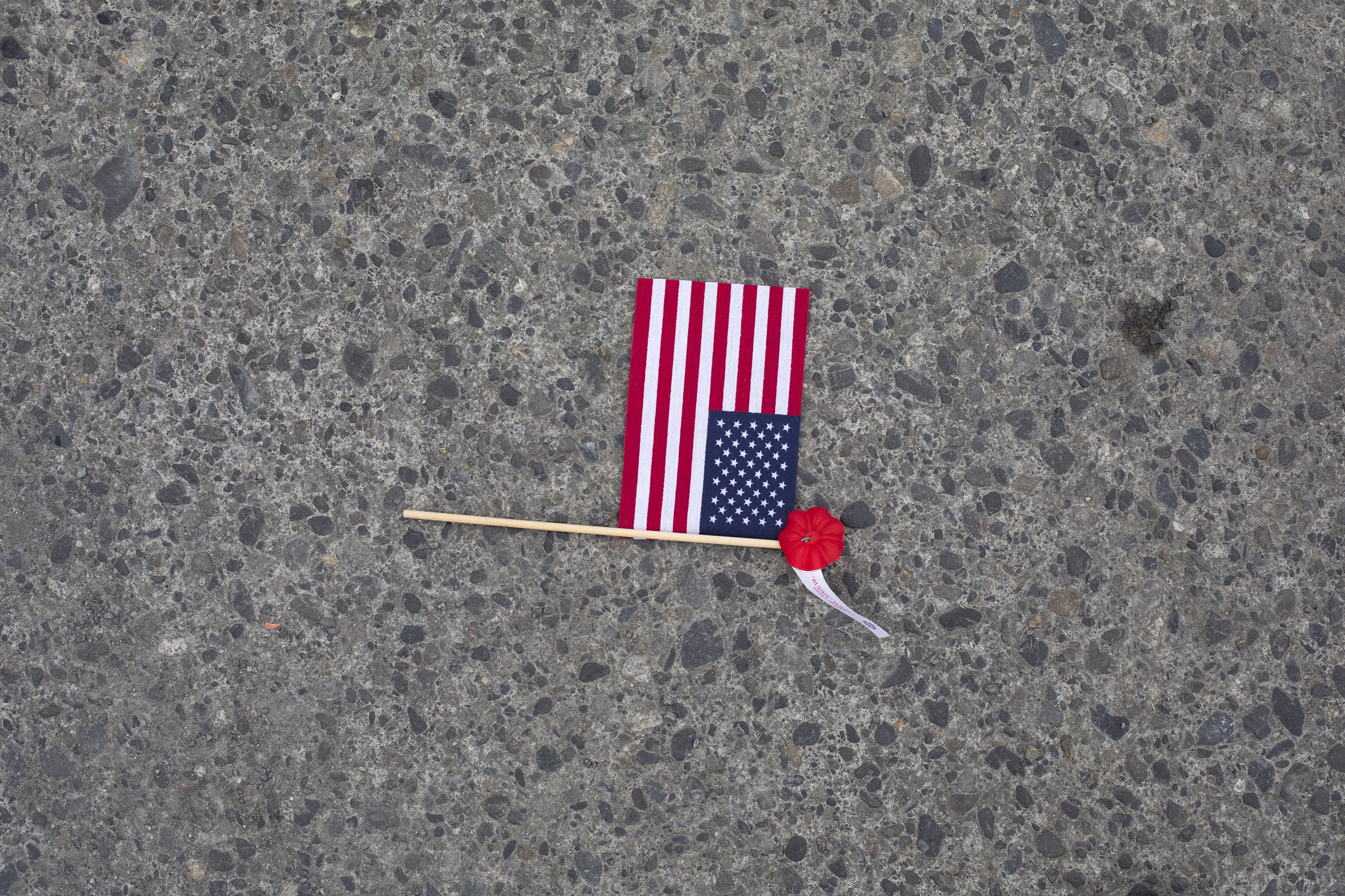 US Waver flag left on ground after 4th of July celebration at downtown Cordova AK